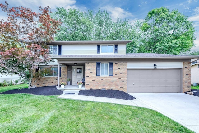 563 Wickham Way, Gahanna, OH 43230 - view of front of home featuring a garage, brick siding, driveway, and a front yard