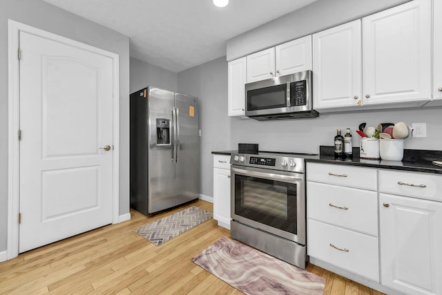 563 Wickham Way, Gahanna, OH 43230 - kitchen with appliances with stainless steel finishes, white cabinets, and light wood-style flooring