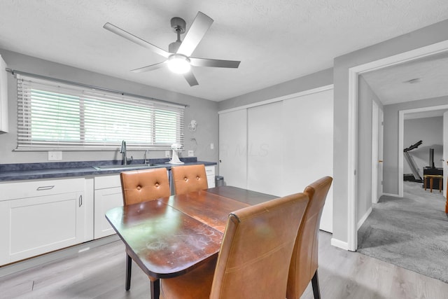 563 Wickham Way, Gahanna, OH 43230 - dining room with light wood-type flooring, a ceiling fan, and a textured ceiling