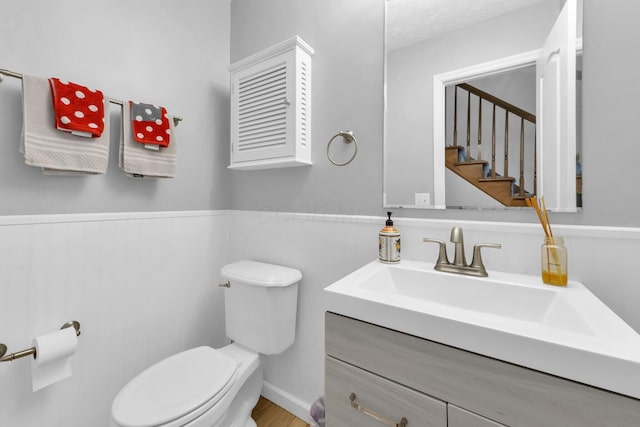 563 Wickham Way, Gahanna, OH 43230 - bathroom featuring vanity, a wainscoted wall, and wood finished floors
