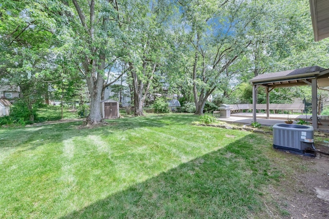 563 Wickham Way, Gahanna, OH 43230 - view of grassy yard featuring a storage shed and a patio