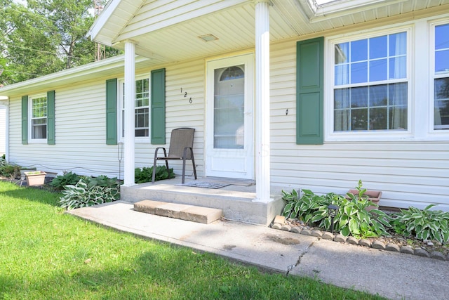 126 Holly Ln, Russells Point, OH 43348 - entrance to property with a porch and a yard