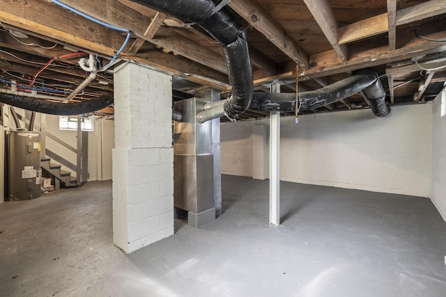 2592 Grasmere Ave, Columbus, OH 43211 - below grade area with electric water heater, stairs, and heating unit