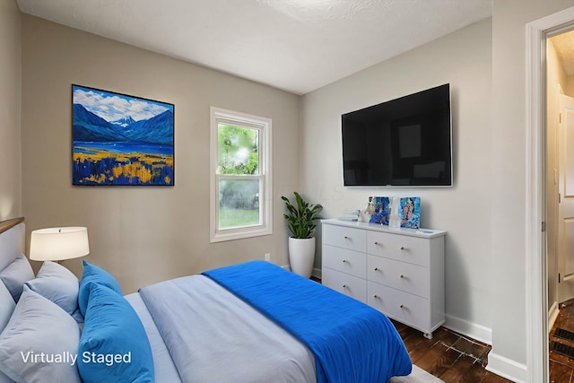 2592 Grasmere Ave, Columbus, OH 43211 - bedroom featuring dark wood-style flooring and baseboards