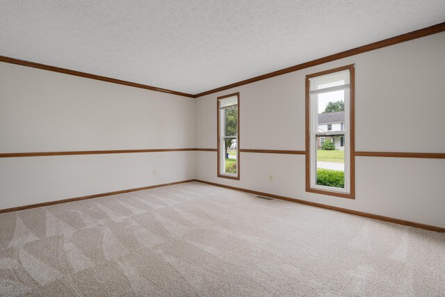 7552 Deer Creek Dr, Columbus, OH 43085 - empty room with light colored carpet, baseboards, ornamental molding, and a textured ceiling