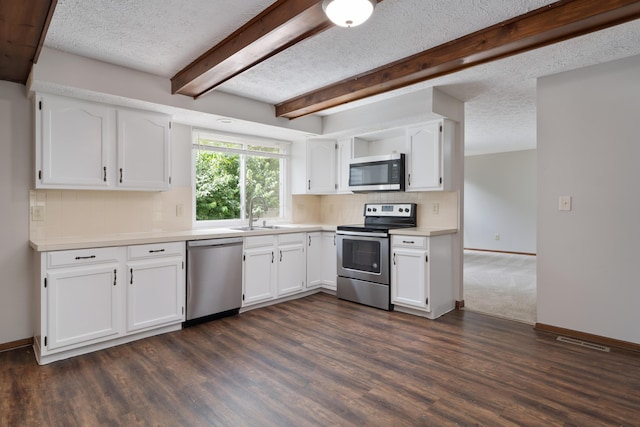 7552 Deer Creek Dr, Columbus, OH 43085 - kitchen featuring stainless steel appliances, a sink, backsplash, white cabinetry, and light countertops