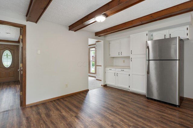 7552 Deer Creek Dr, Columbus, OH 43085 - kitchen with freestanding refrigerator, plenty of natural light, dark wood-type flooring, beam ceiling, and baseboards