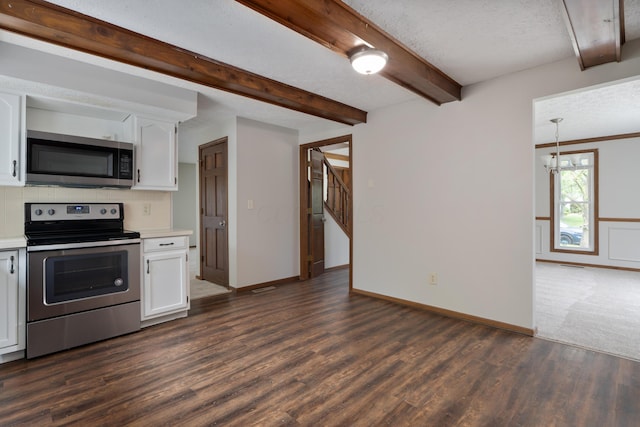 7552 Deer Creek Dr, Columbus, OH 43085 - kitchen with appliances with stainless steel finishes, light countertops, dark wood-style flooring, white cabinetry, and a textured ceiling