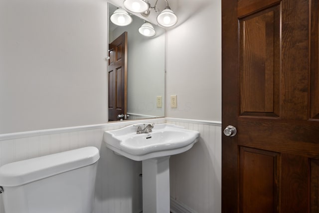 7552 Deer Creek Dr, Columbus, OH 43085 - half bath with wainscoting, toilet, and a sink