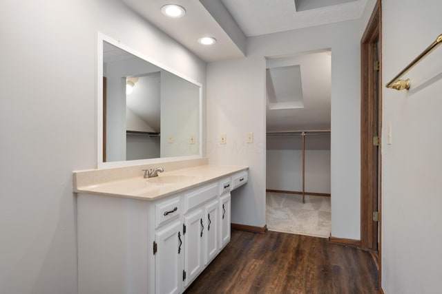 7552 Deer Creek Dr, Columbus, OH 43085 - bathroom with vanity, recessed lighting, wood finished floors, and baseboards
