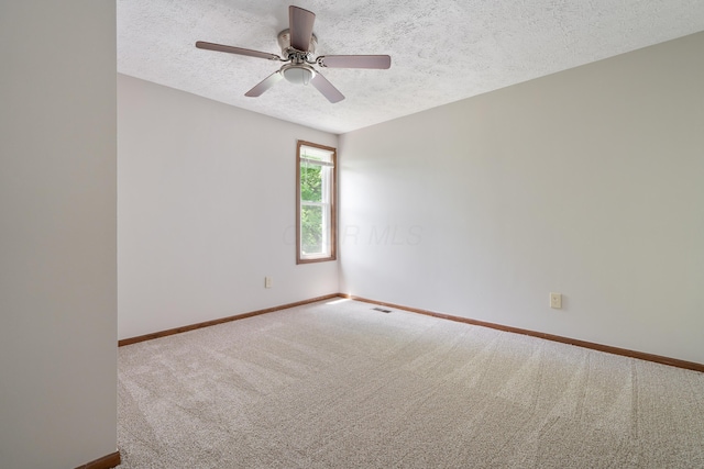 7552 Deer Creek Dr, Columbus, OH 43085 - empty room featuring a textured ceiling, carpet floors, baseboards, and a ceiling fan
