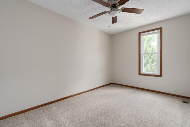 7552 Deer Creek Dr, Columbus, OH 43085 - unfurnished room with a textured ceiling, light carpet, baseboards, and ceiling fan