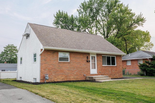 1079 Loring Rd, Columbus, OH 43224 - view of front of house featuring brick siding and roof with shingles