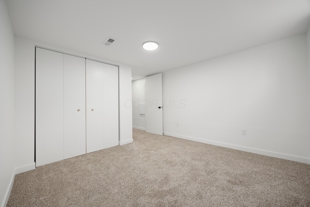 1079 Loring Rd, Columbus, OH 43224 - unfurnished bedroom with carpet floors, a closet, and baseboards