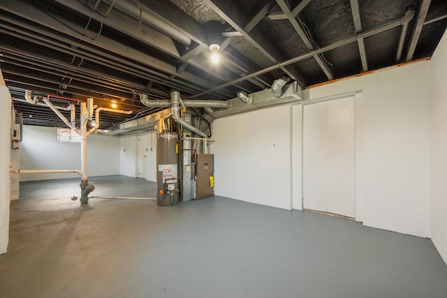 1079 Loring Rd, Columbus, OH 43224 - unfinished below grade area featuring gas water heater, concrete block wall, and heating unit
