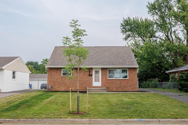 1079 Loring Rd, Columbus, OH 43224 - view of front of home with brick siding, roof with shingles, and entry steps