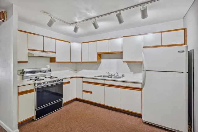 929 Fairwood Ave, Marion, OH 43302 - kitchen with freestanding refrigerator, stove, under cabinet range hood, light countertops, and white cabinets