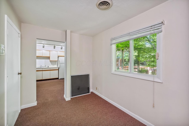 929 Fairwood Ave, Marion, OH 43302 - unfurnished bedroom featuring freestanding refrigerator and carpet flooring