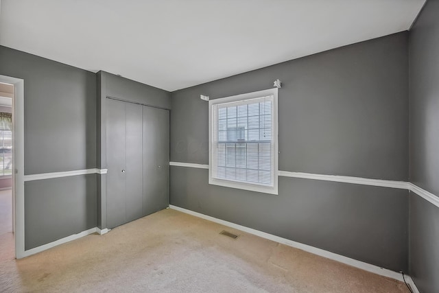 929 Fairwood Ave, Marion, OH 43302 - unfurnished bedroom featuring a closet and carpet flooring