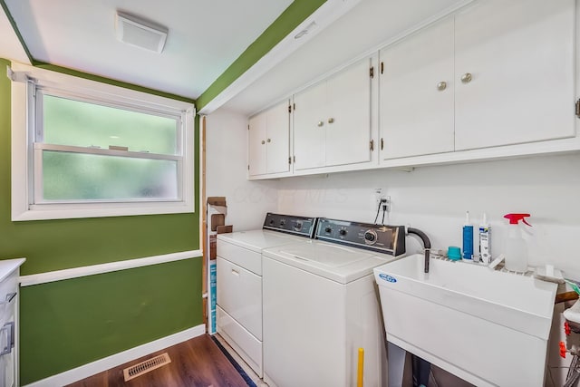 929 Fairwood Ave, Marion, OH 43302 - washroom featuring cabinet space, washer and dryer, and dark wood finished floors