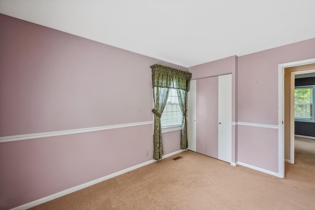 929 Fairwood Ave, Marion, OH 43302 - unfurnished bedroom with light colored carpet and a closet