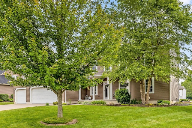 405 Tyler Station Dr, Johnstown, OH 43031 - view of property hidden behind natural elements with a front yard, driveway, a garage, and a porch