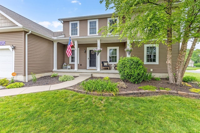 405 Tyler Station Dr, Johnstown, OH 43031 - view of front facade with covered porch, a front lawn, and a garage