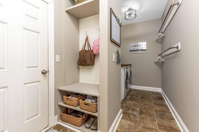 405 Tyler Station Dr, Johnstown, OH 43031 - mudroom featuring washer and dryer, stone tile floors, and baseboards