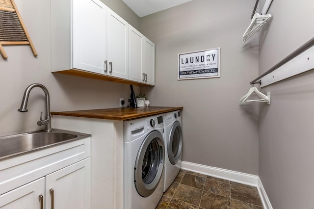 405 Tyler Station Dr, Johnstown, OH 43031 - washroom with cabinet space, washing machine and dryer, baseboards, and dark stone finish flooring