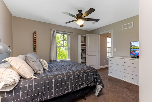 405 Tyler Station Dr, Johnstown, OH 43031 - bedroom with dark carpet, a ceiling fan, and baseboards