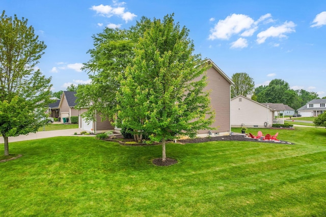 405 Tyler Station Dr, Johnstown, OH 43031 - view of green lawn with a garage and driveway