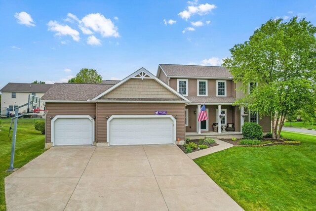 405 Tyler Station Dr, Johnstown, OH 43031 - view of front of house with a porch, a front lawn, an attached garage, and driveway