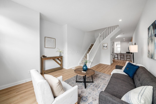 1116 Summit St Unit 1114, Columbus, OH 43201 - living area with wood finished floors, stairway, baseboards, and recessed lighting