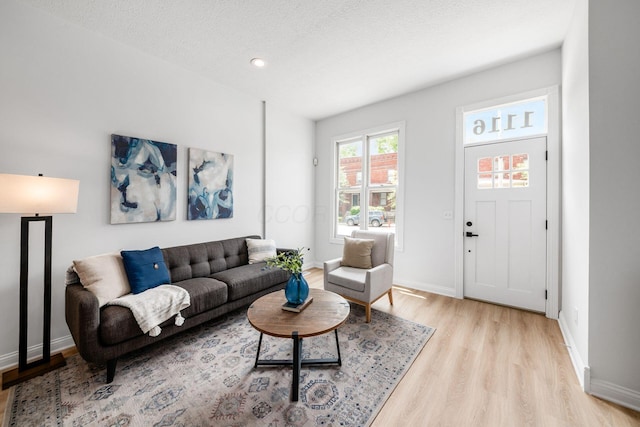 1116 Summit St Unit 1114, Columbus, OH 43201 - living area with light wood-type flooring, baseboards, a textured ceiling, and recessed lighting