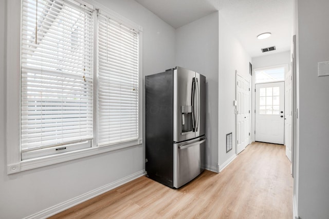 1116 Summit St Unit 1114, Columbus, OH 43201 - kitchen with stainless steel refrigerator with ice dispenser, light wood-style flooring, and baseboards