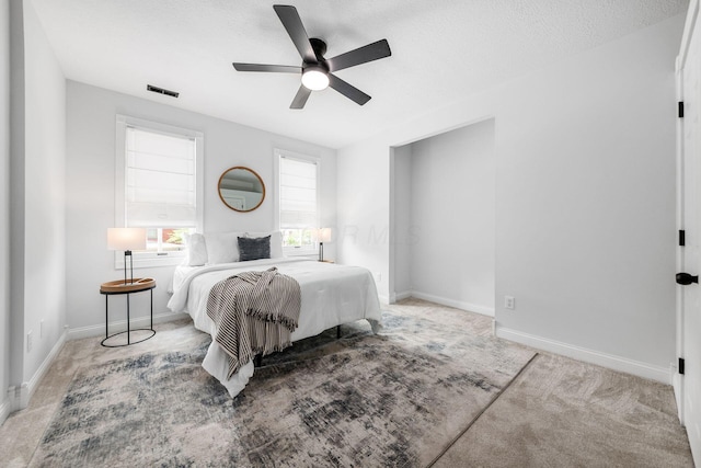 1116 Summit St Unit 1114, Columbus, OH 43201 - bedroom with baseboards, a ceiling fan, and light carpet