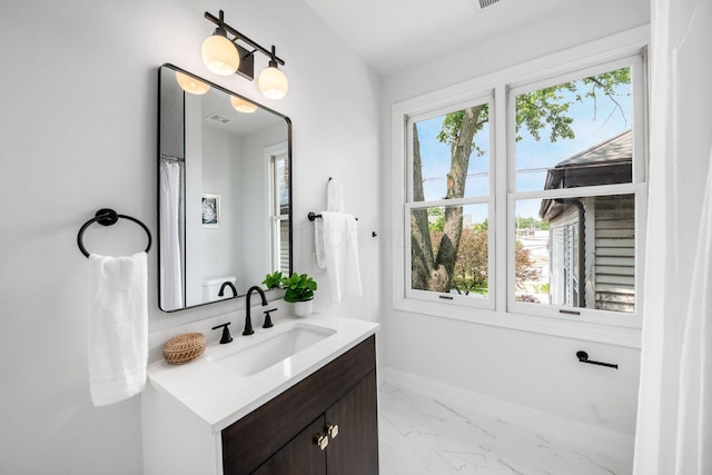 1116 Summit St Unit 1114, Columbus, OH 43201 - full bathroom featuring vanity, plenty of natural light, and marble finish floors