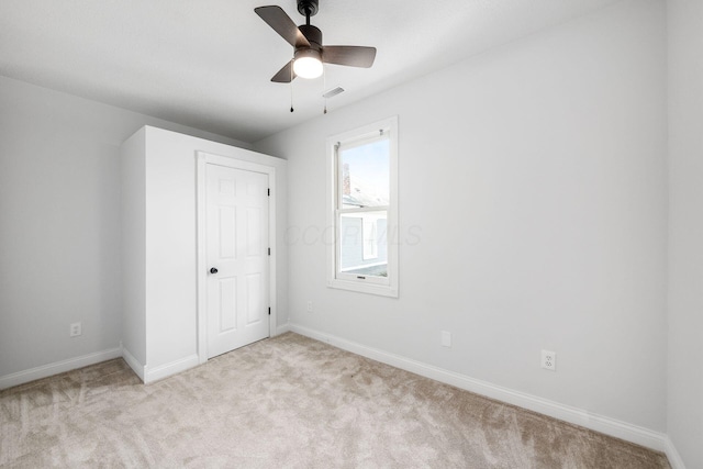 1116 Summit St Unit 1114, Columbus, OH 43201 - unfurnished bedroom with carpet flooring, baseboards, and ceiling fan
