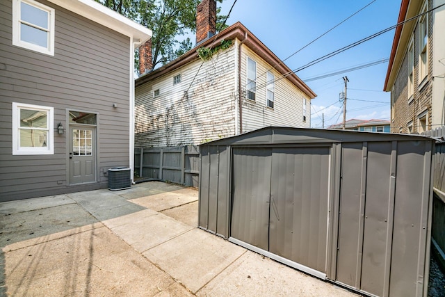 1116 Summit St Unit 1114, Columbus, OH 43201 - back of house featuring a chimney, a patio area, and cooling unit