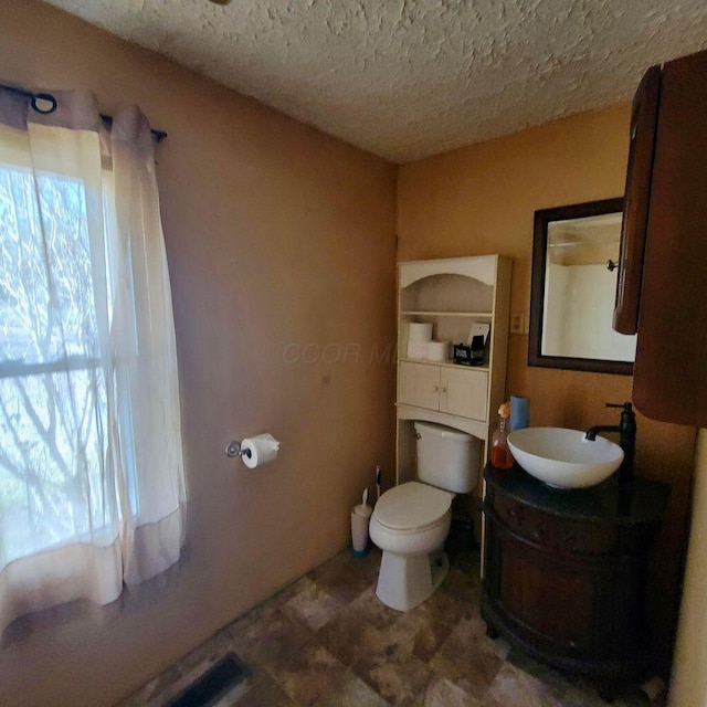 3813 N Old State Rd, Delaware, OH 43015 - bathroom featuring toilet, vanity, and a textured ceiling