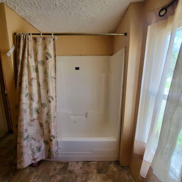 3813 N Old State Rd, Delaware, OH 43015 - bathroom with shower / bathtub combination with curtain and a textured ceiling