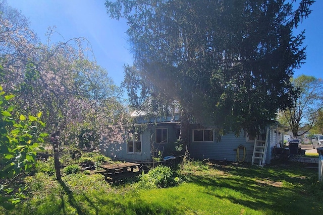 3813 N Old State Rd, Delaware, OH 43015 - rear view of property featuring a lawn