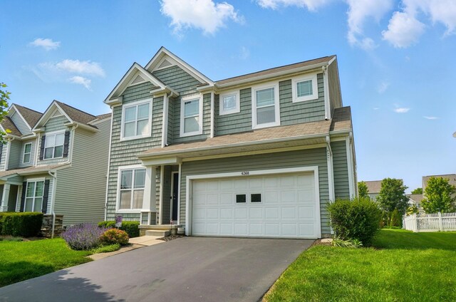 6368 Casado Dr, Columbus, OH 43213 - view of front of house with a garage and asphalt driveway