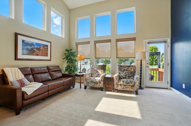 6368 Casado Dr, Columbus, OH 43213 - living area with plenty of natural light, a high ceiling, carpet floors, and baseboards