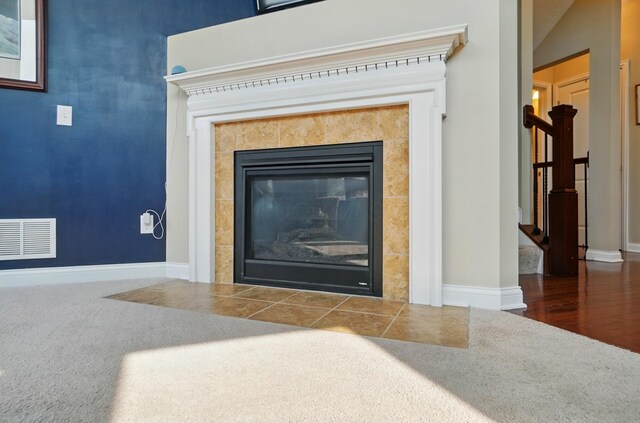 6368 Casado Dr, Columbus, OH 43213 - detailed view of carpet floors, a tiled fireplace, and baseboards