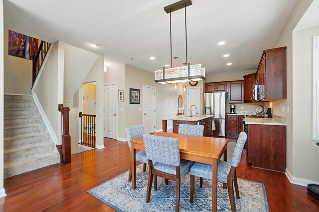 6368 Casado Dr, Columbus, OH 43213 - dining area with dark wood-type flooring, baseboards, recessed lighting, and stairs