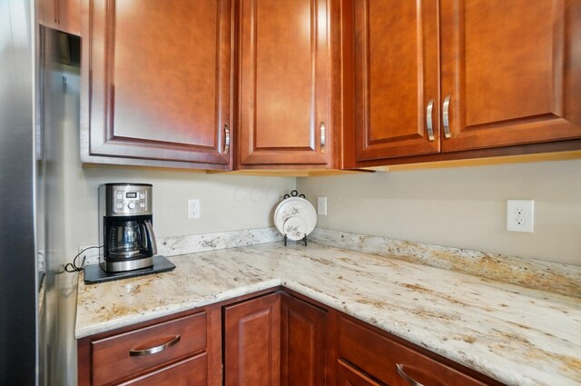 6368 Casado Dr, Columbus, OH 43213 - kitchen with light stone countertops and freestanding refrigerator