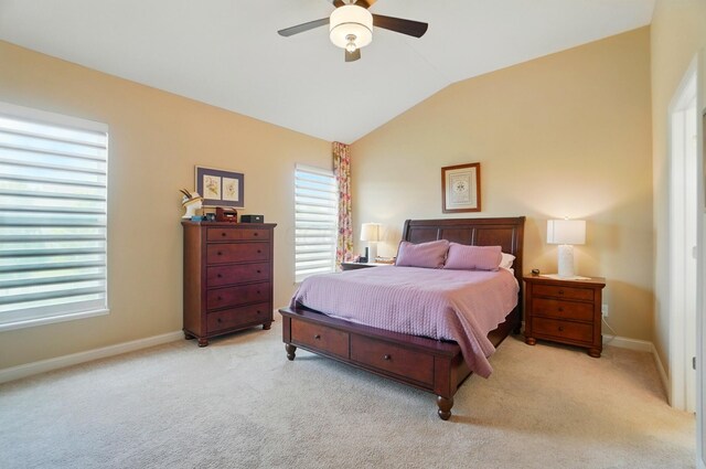 6368 Casado Dr, Columbus, OH 43213 - carpeted bedroom featuring lofted ceiling, multiple windows, baseboards, and ceiling fan
