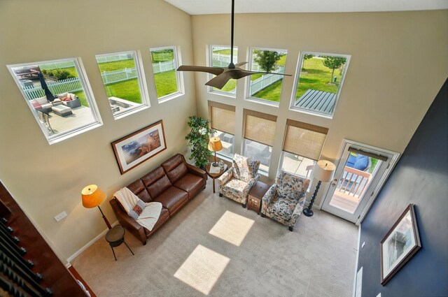 6368 Casado Dr, Columbus, OH 43213 - living area featuring high vaulted ceiling, healthy amount of natural light, ceiling fan, carpet floors, and baseboards