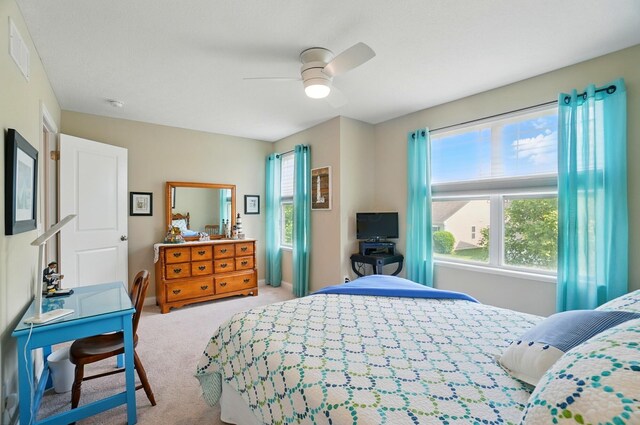 6368 Casado Dr, Columbus, OH 43213 - bedroom with light colored carpet, ceiling fan, and baseboards